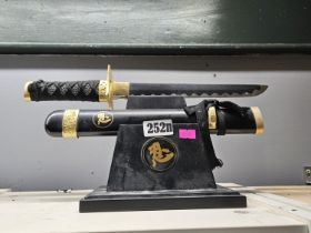 Japanese Samurai sword and Katana on wooden support