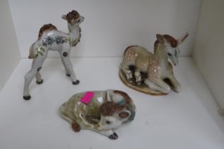 Three Basil Matthews studio pottery figures depicting camel and two donkeys.