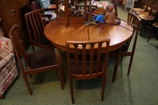 Teak Meredew Circular table on tapering legs with a set of 4 upholstered chairs