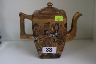 Japanese gilt Satsuma ware teapot with figural decoration & character marks to base.