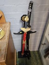 The Sword of the God of War and a Samurai Sword with stand