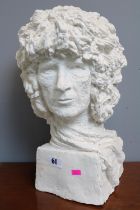 Large white plaster bust depicting Queen guitarist Brian May, dated 1976