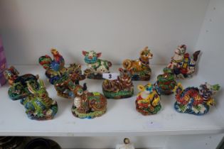 Collection of twelve hand painted 20th century Chinese ceramic Zodiac Sign figures with character