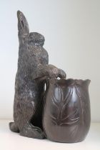 Cast Bronze vase sculpture depicting a Rabbit sitting at a large lettuce.