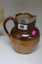 19th Century Doulton Lambeth silver rimmed harvest jug with unusual decoration.
