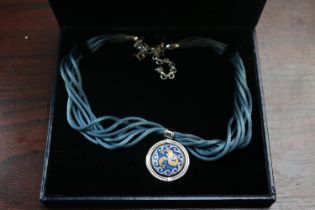 Boxed Freywille Swiss Necklace of a Circular pendant with Dolphin decoration