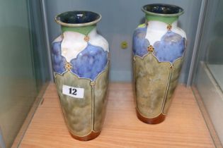 Pair of Royal Doulton glazed vases of cylindrical tapering form with flared rims decorated in Art