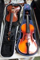 Cased Antoni Debut Violin and a Earlier violin in case