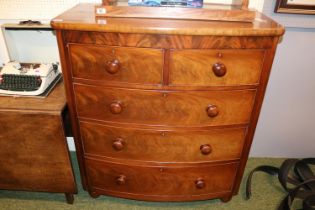 Victorian Mahogany bow fronted chest of 2 over 3 drawers with turned handles supported on bun feet