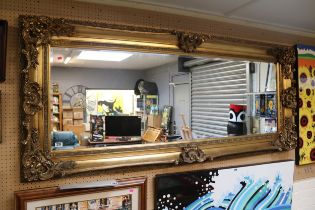 Large Ornate Gilt Gesso framed wall mirror with bevel edge 190cm in Length
