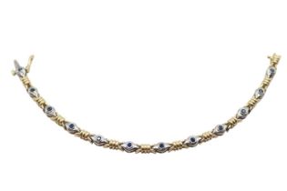 Ladies 14ct Gold Sapphire set bracelet of 12 Rub over set stones in white gold with Yellow gold