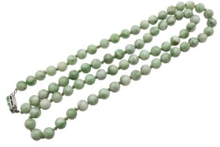 Long Jade hand knotted Polished Green and Celadon Bead necklace on white metal clasp with carved