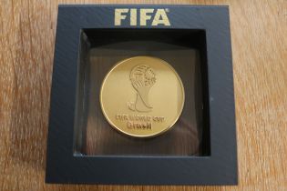 2014 FIFA WORLD CUP PARTICIPATION MEDAL Presented here is a 2014 FIFA World Cup gold participation