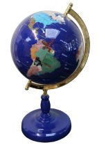 Large Gemstone Semi Precious Globe with brass support over blue pedestal base. 60cm in Height