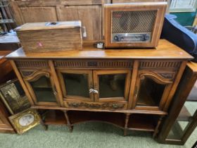 Victorian Walnut dresser base with glazed doors over drawer and under tier with turned supports