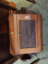 Oak Victorian corner cabinet with carved panel front with brass fittings