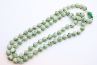 Long Jade hand knotted Polished Green and Celadon Bead necklace on white metal clasp with carved