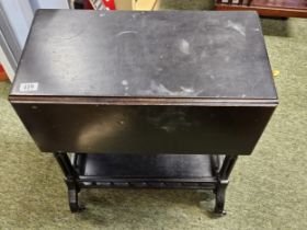 Ebonised Aesthetics movement drop leaf table with galleried under tier