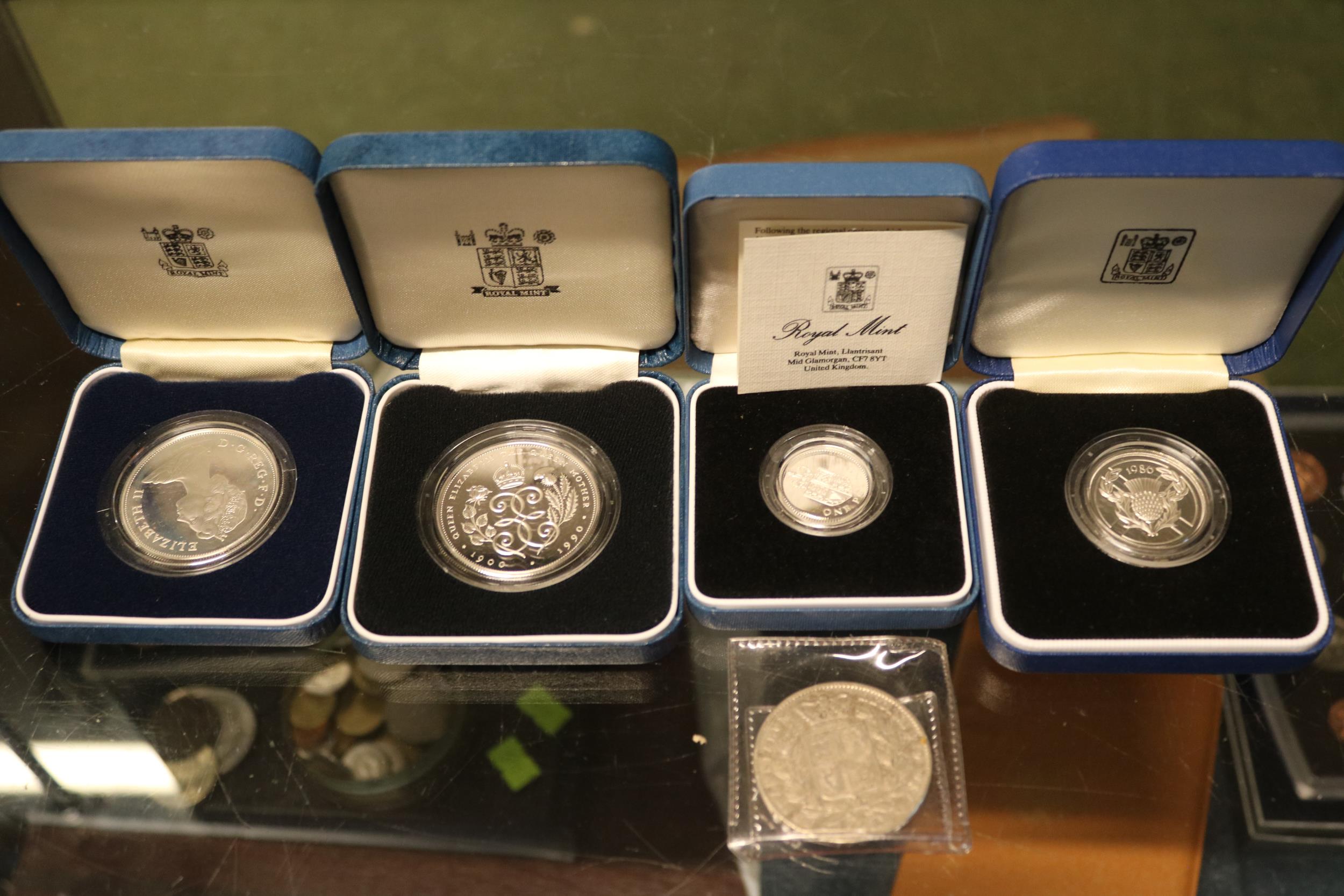 4 Boxed Silver Proof Royal Mint Coins to include 1988 £1, 1986 £2 Coin, 1990 £5, 1981 Prince of
