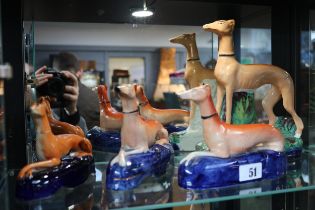 Collection of 19thC Staffordshire Greyhound figures