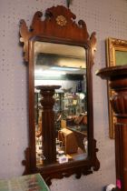 Framed Georgian Mahogany scroll decorated mirror with gilded floral roundel