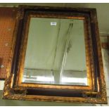 A decorative gilt framed mirror