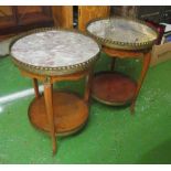 A pair of marble top circular tables