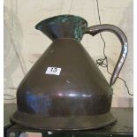 A brass two gallon jug