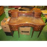 An Edwardian inlaid serpentine writing desk with brass gallery and four drawers to top and five