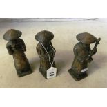 Three bronze colour pottery figures with musical instruments, incised marks CDF Hanoi to bases (a/