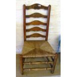 An oak ladder back chair dated 1926