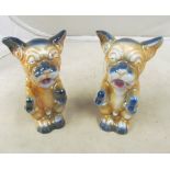 A pair of pottery dogs