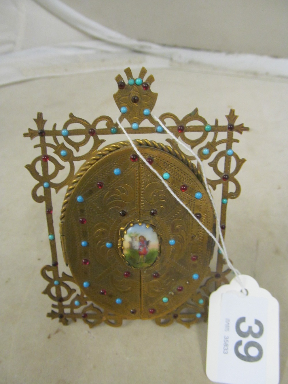 A small ornate gilt frame inset with turquoise and red stones and small porcelain plaque to - Image 2 of 4