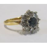 An 18ct gold sapphire and diamond cluster ring size K/L
