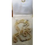 A set of Mikimoto pearls and Mikimoto timepiece