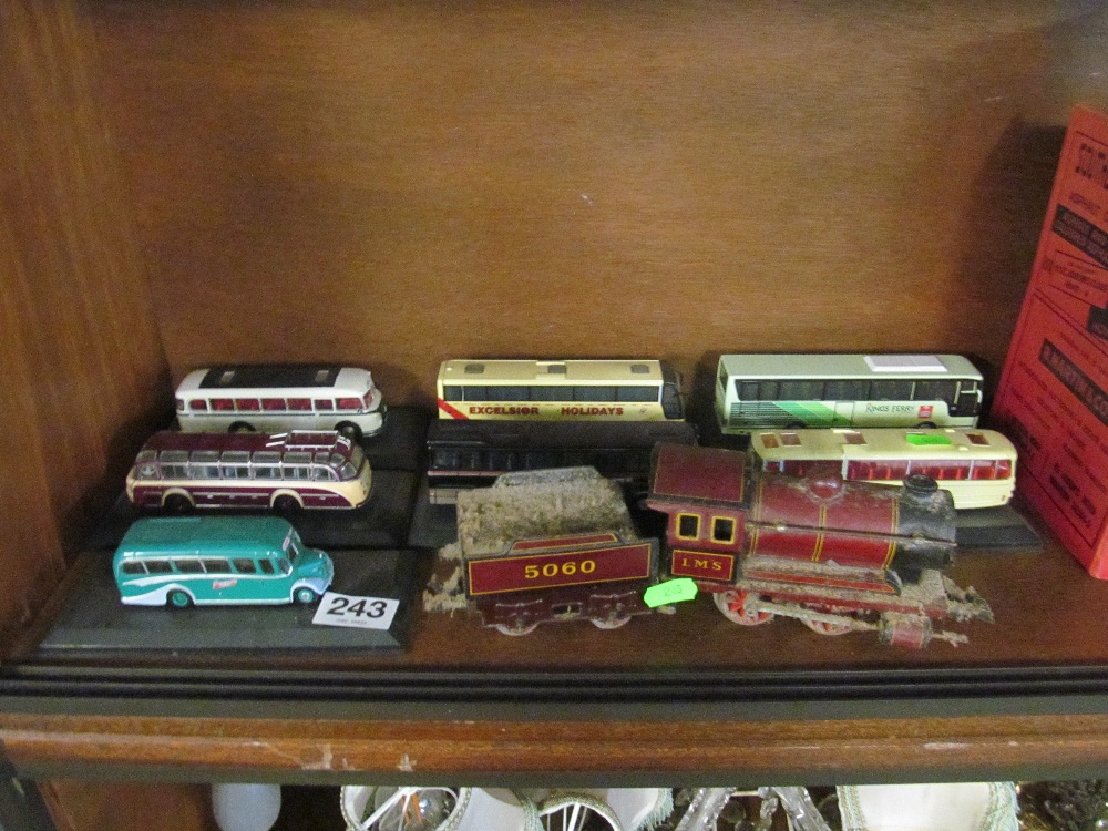 A tinplate train and tender and various model buses