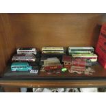 A tinplate train and tender and various model buses