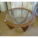 A teak and glass top coffee table