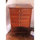 A five drawer Edwardian music cabinet