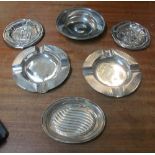A pair of silver ashtrays, dish, oval dish and two silver coloured dishes