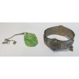 A Jade pendant and an eastern silver coloured bangle