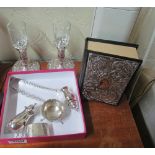 A pair of silver candlesticks, napkin ring and other silver