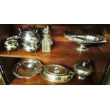 A plated entree dish, plated teaset and other plated items