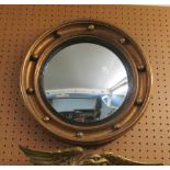 A circular Regency style convex mirror