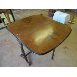 A Victorian walnut Sutherland table with black edging