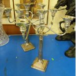 A pair of plated candelabra