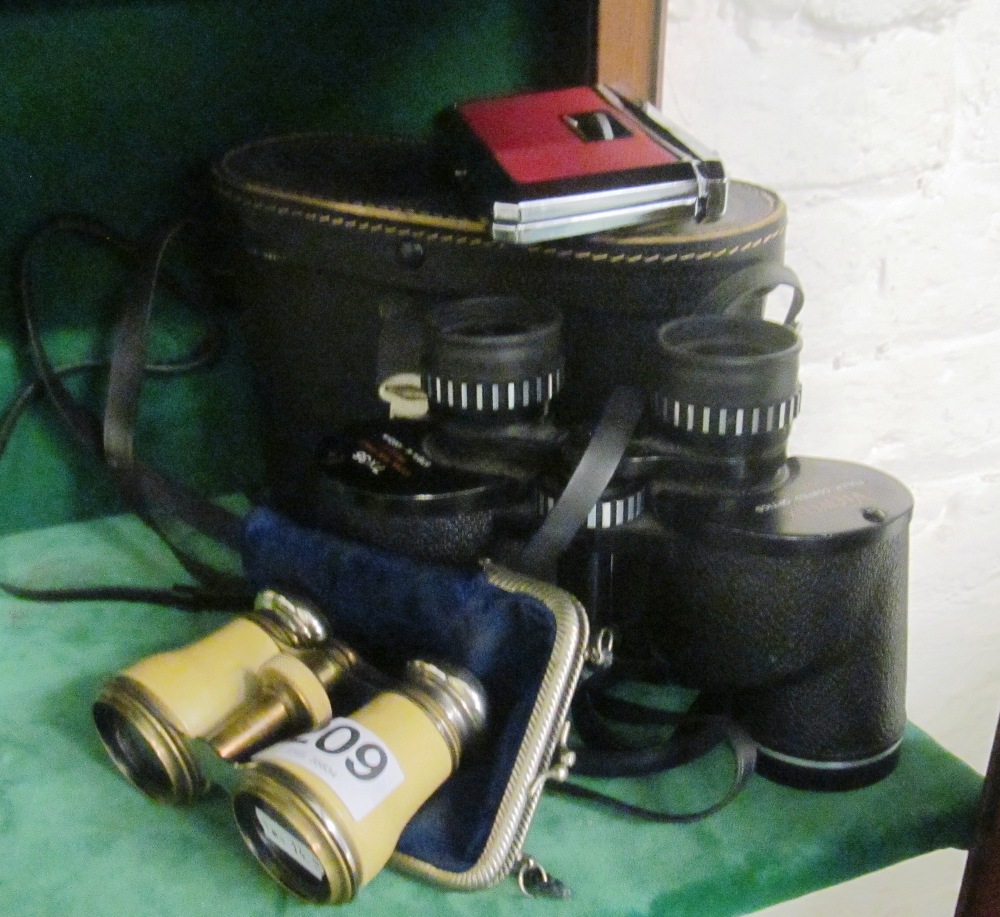 A pair binoculars and opera glasses