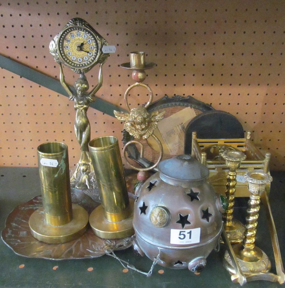 A brass clock, candlestick, cart, two trench art spill vases et cetera