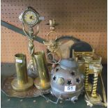 A brass clock, candlestick, cart, two trench art spill vases et cetera
