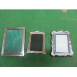 Three silver photo frames